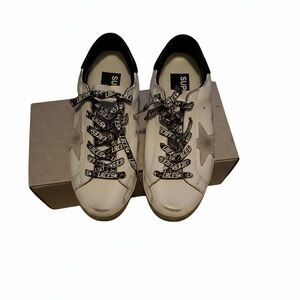 Stylish White Sneakers with Black Accents